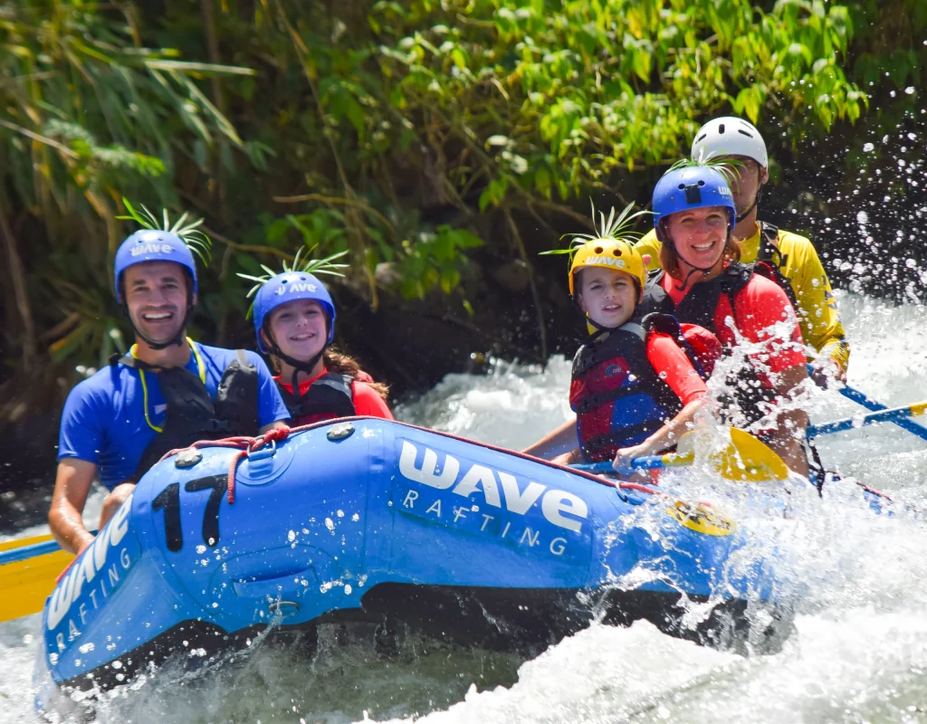family enjoying rafting