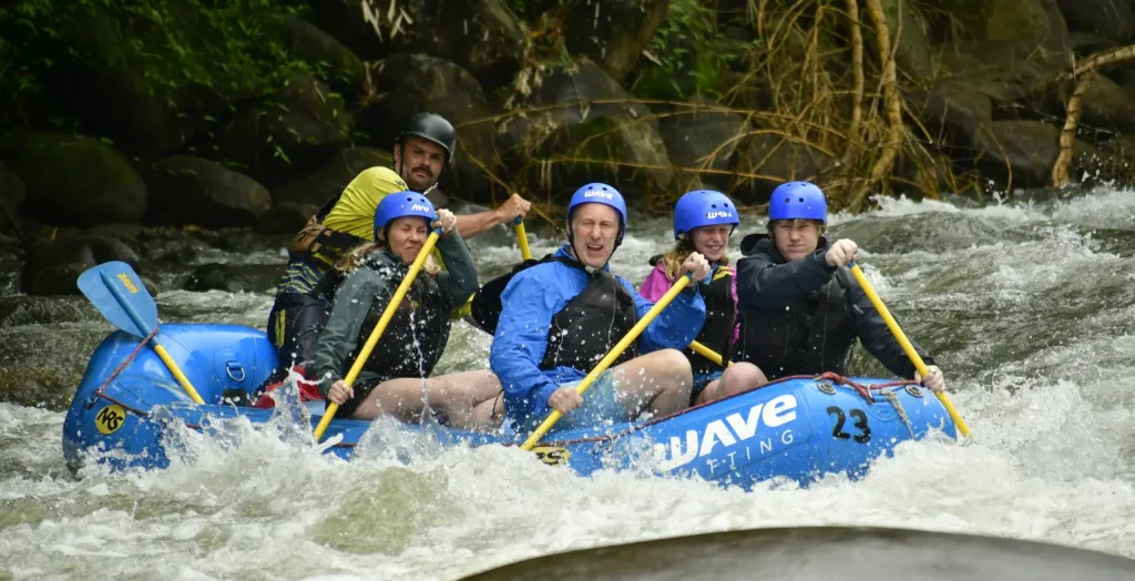 group paddling together through a river section with wave expeditions in costa rica