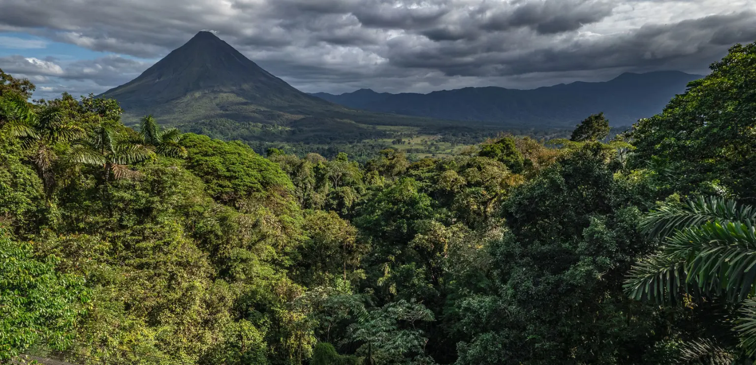 Panoramic view of Arenal Volcano and lush rainforest in La Fortuna, Costa Rica