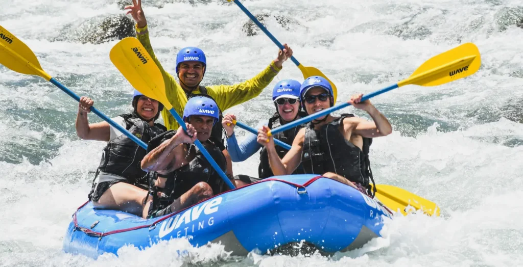 rafting adventure in arenal costa rica with wave expeditions group cheering
