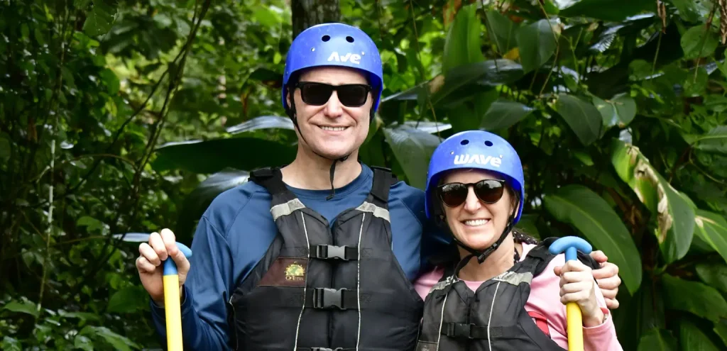 couple smiling in rafting gear during a tour in la fortuna costa rica